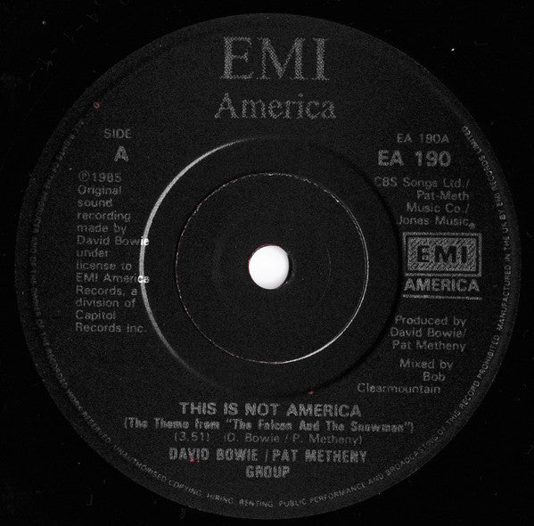 David Bowie / Pat Metheny Group : This Is Not America (Theme From The Motion Picture, The Falcon And The Snowman) (7", Single, Bla)