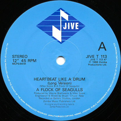 A Flock Of Seagulls : Heartbeat Like A Drum (12", Single)