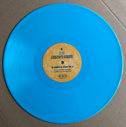 The Band Whose Name Is A Symbol / Shooting Guns : In Search Of Highs Volume 2 (LP, Ltd, Blu)